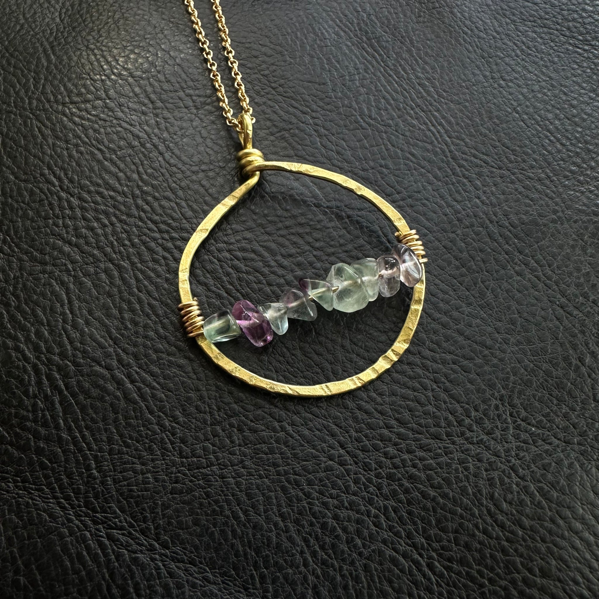 Hoop of textured Brass with Fluorite Crystal